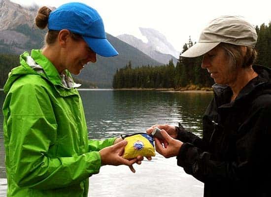 two people look through first aid fit for the right supplies
